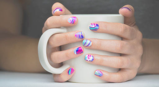 Water marbling-style nail maintenance is pretty similar to how you take care of your regular nails