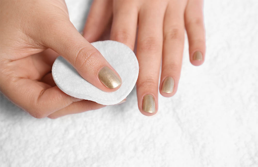 You should gently rub the cotton ball over your gel nail polish. 