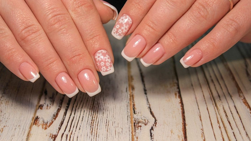Applying acrylic nails carefully to avoid letting them go under your skin.